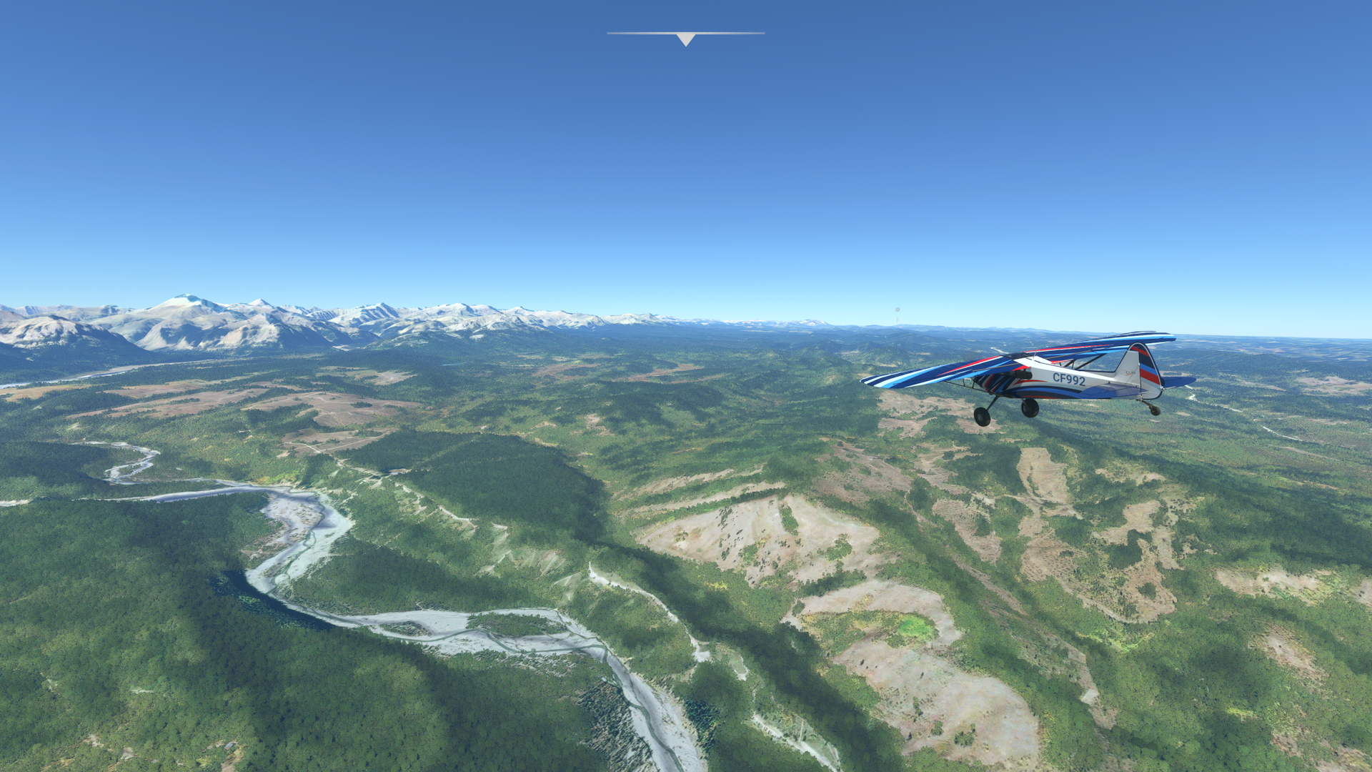 Flight over the countryside in Alberta, with the Rockies on the horizon | Microsoft Flight Simulator